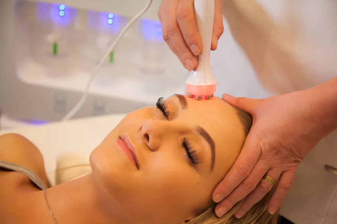 Woman receiving a facial skin repair treatment at New Esthetic